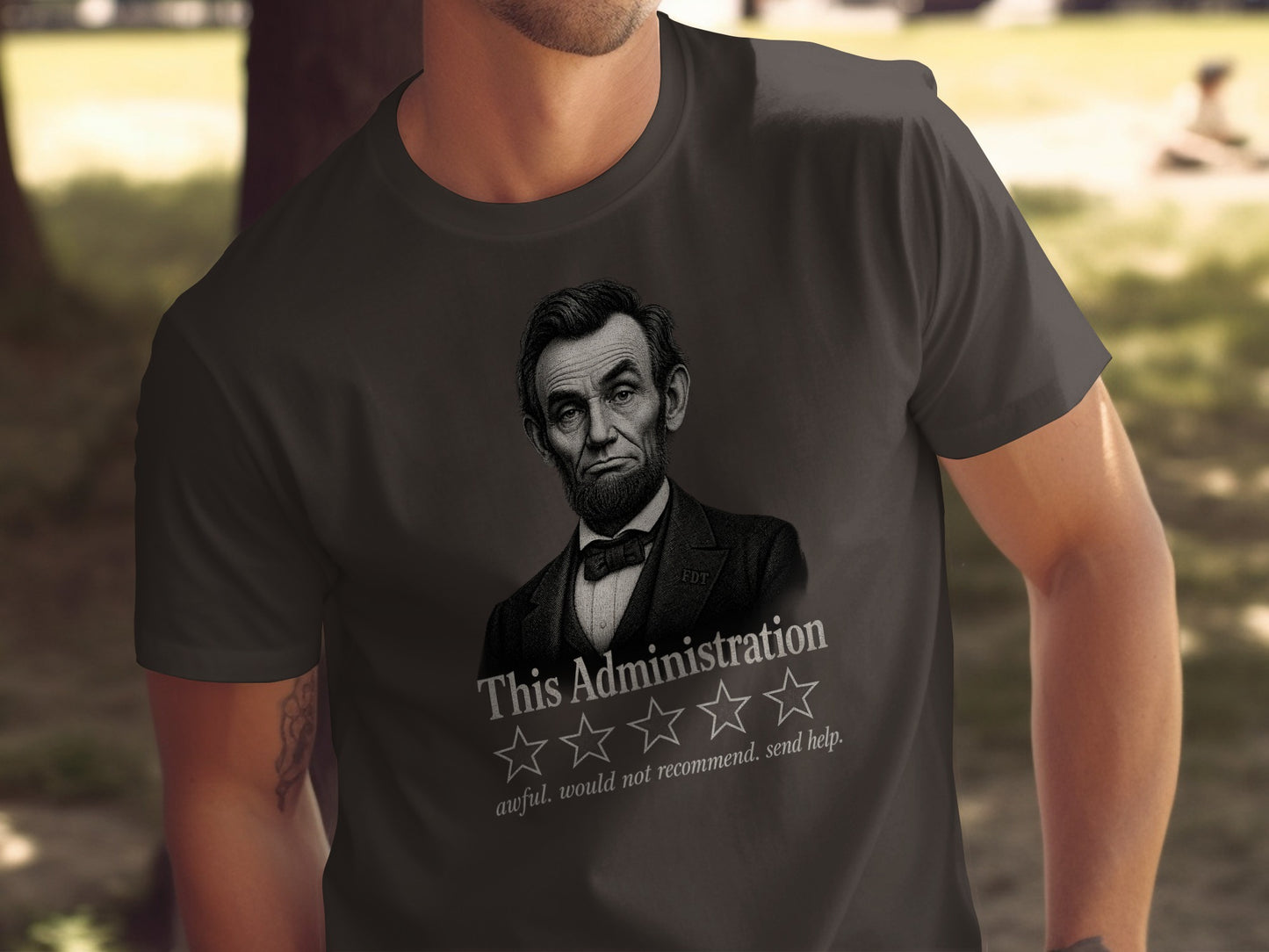 Abraham Lincoln on a dark t-shirt with "This Administration" and one star.