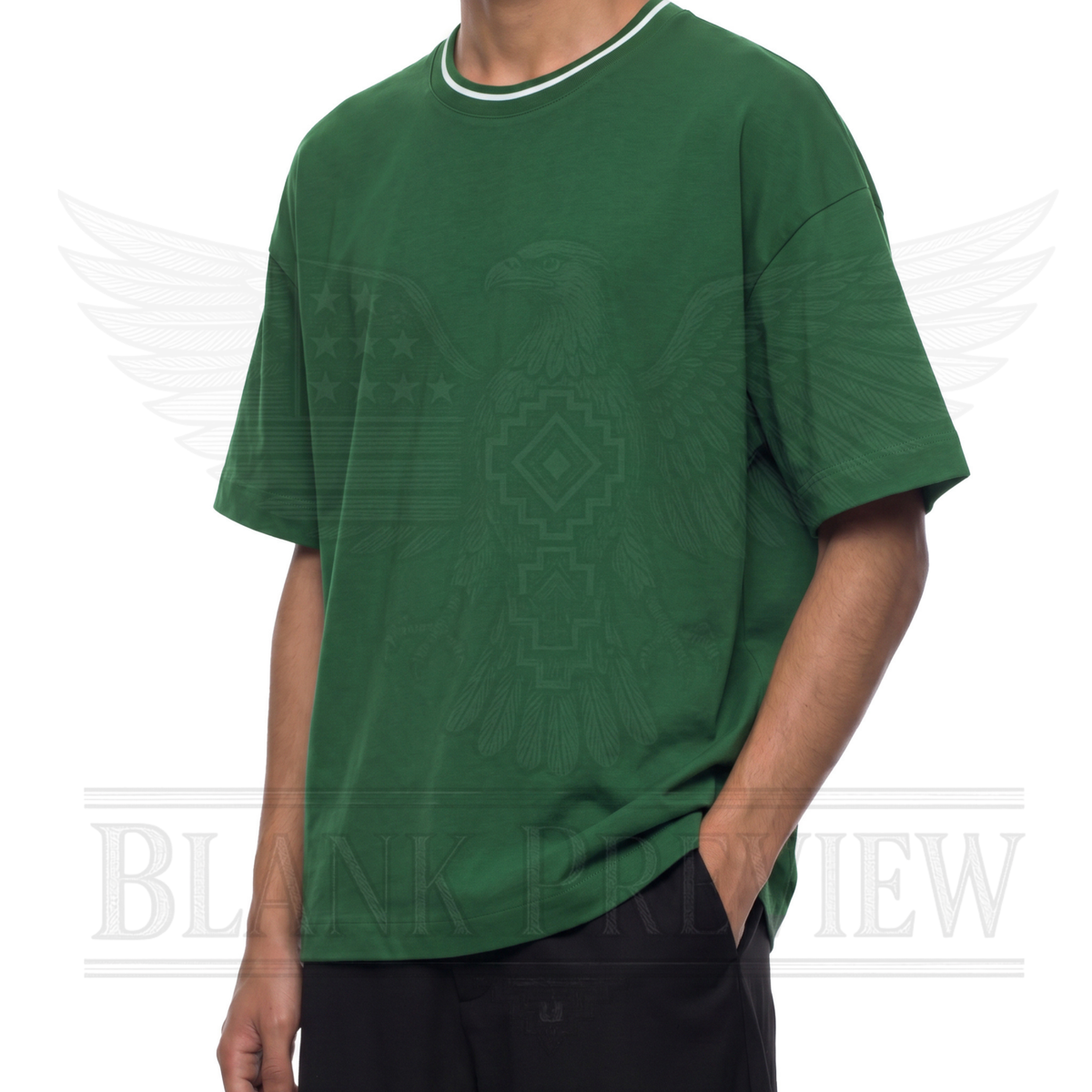 A person wearing a green t-shirt with a graphic design on it.