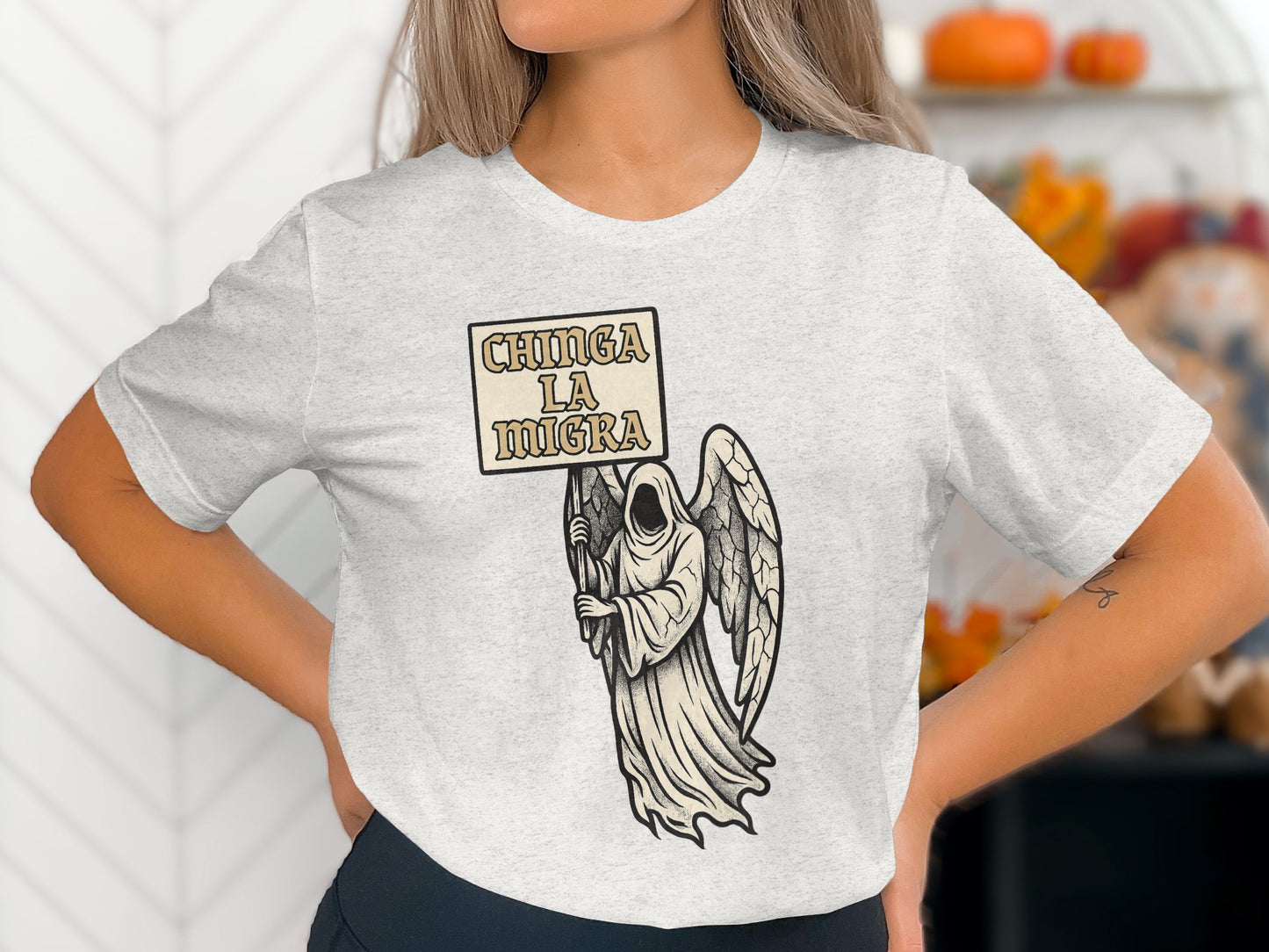 Chinga La Migra Design Gracefully Displayed on T-shirt product