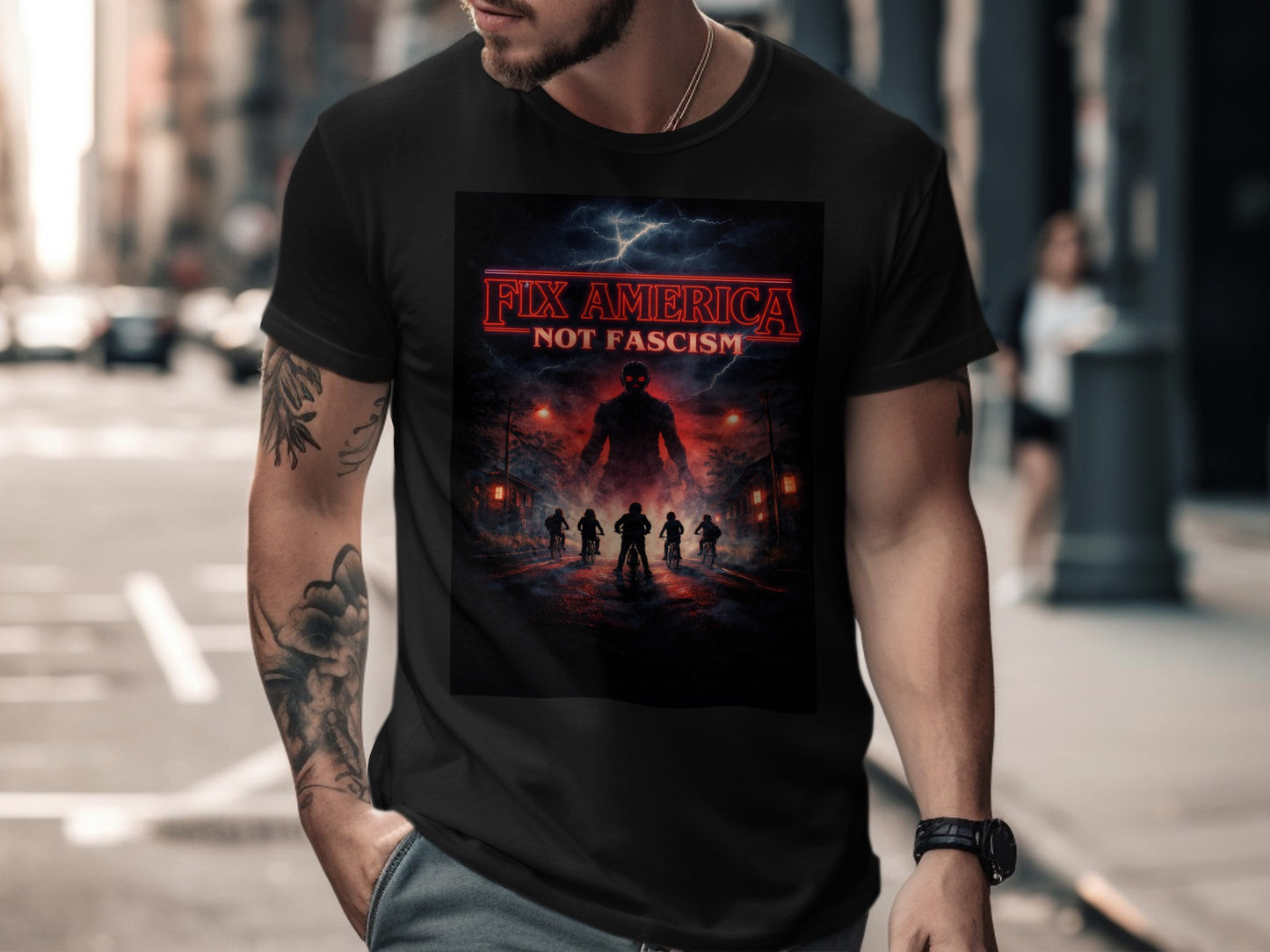 Black t-shirt with "FIX AMERICA NOT FASCISM" text and a dark, silhouetted scene.