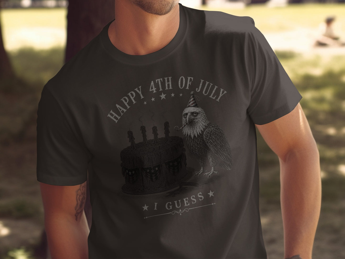 Dark t-shirt with "Happy 4th of July I Guess" and an eagle wearing a party hat.