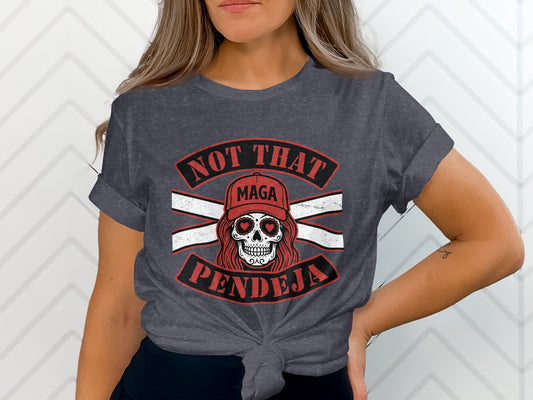 Dark grey t-shirt with white and red "NOT THAT MAGA PENDEJA" text and skull graphic.