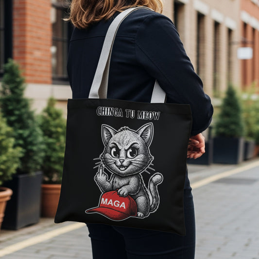 Black tote bag with a cat flipping off a MAGA hat, text reads "CHINGA TU MEOW".