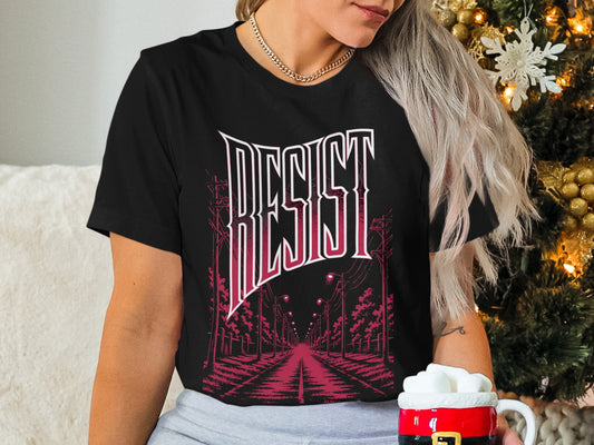 Black t-shirt with "RESIST" text and a street scene graphic.