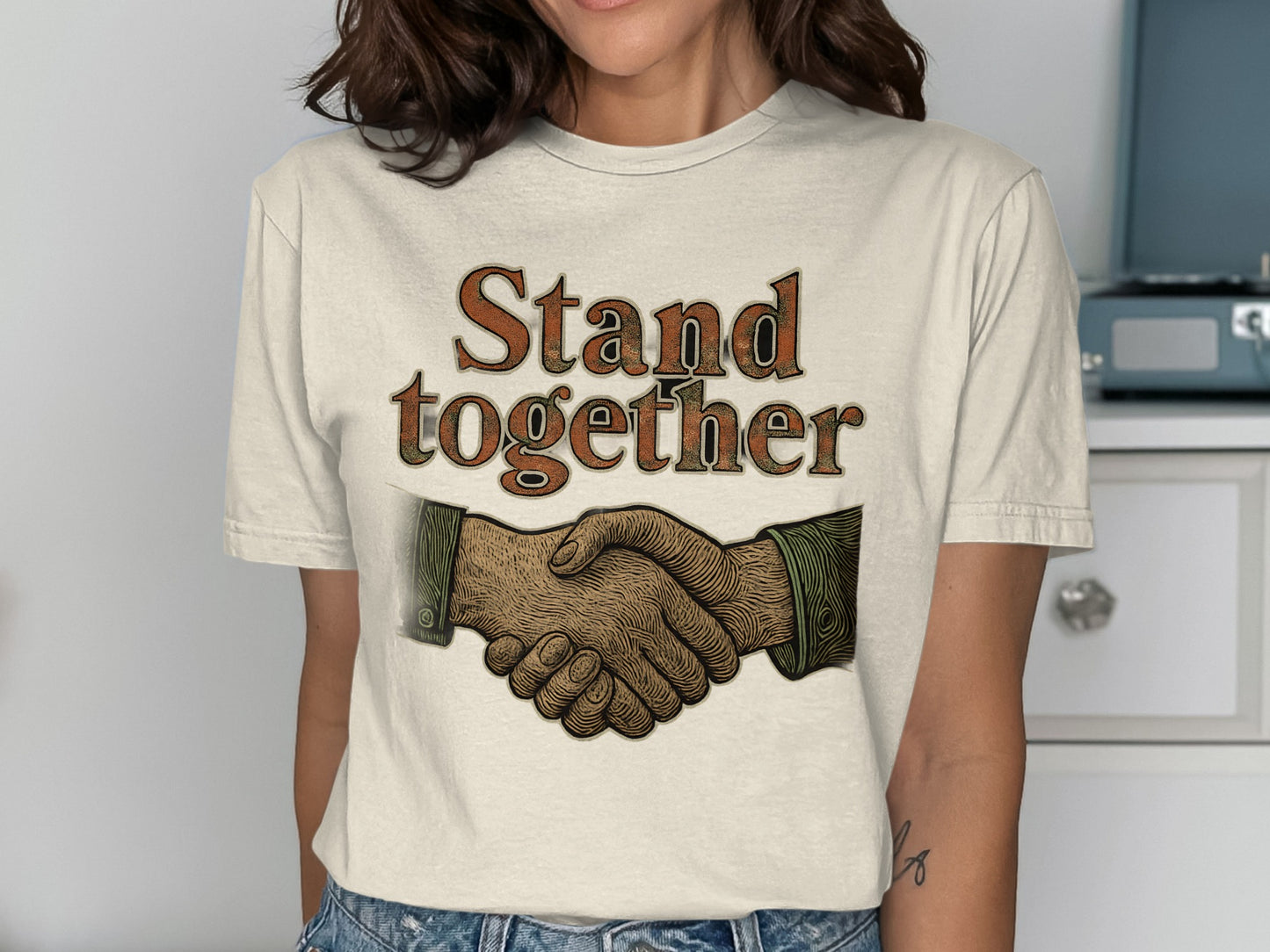 Stand together handshaking hands graphic tee product