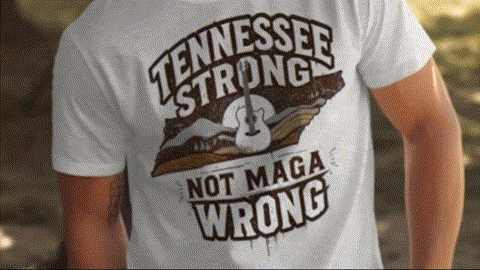 A white t-shirt with a graphic design that says "TENNESSEE STRONG NOT MAGA WRONG" printed on it.