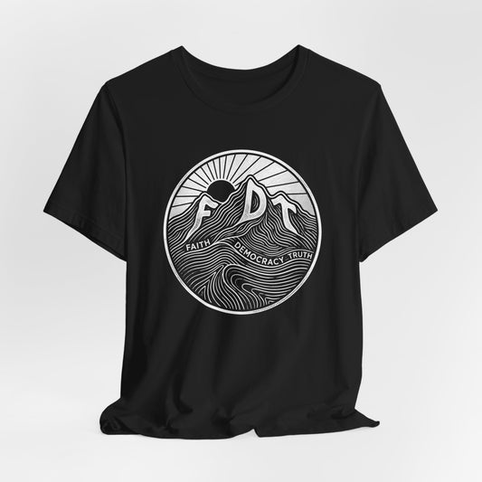 Black t-shirt with circular logo featuring mountains, sun, and text "FAITH DEMOCRACY TRUTH".