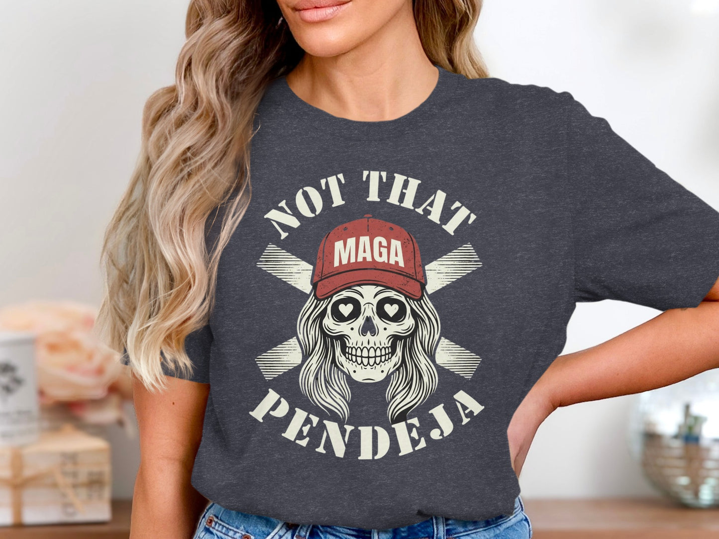 Dark t-shirt with a skull wearing a red MAGA hat and text "NOT THAT PENDEJA".