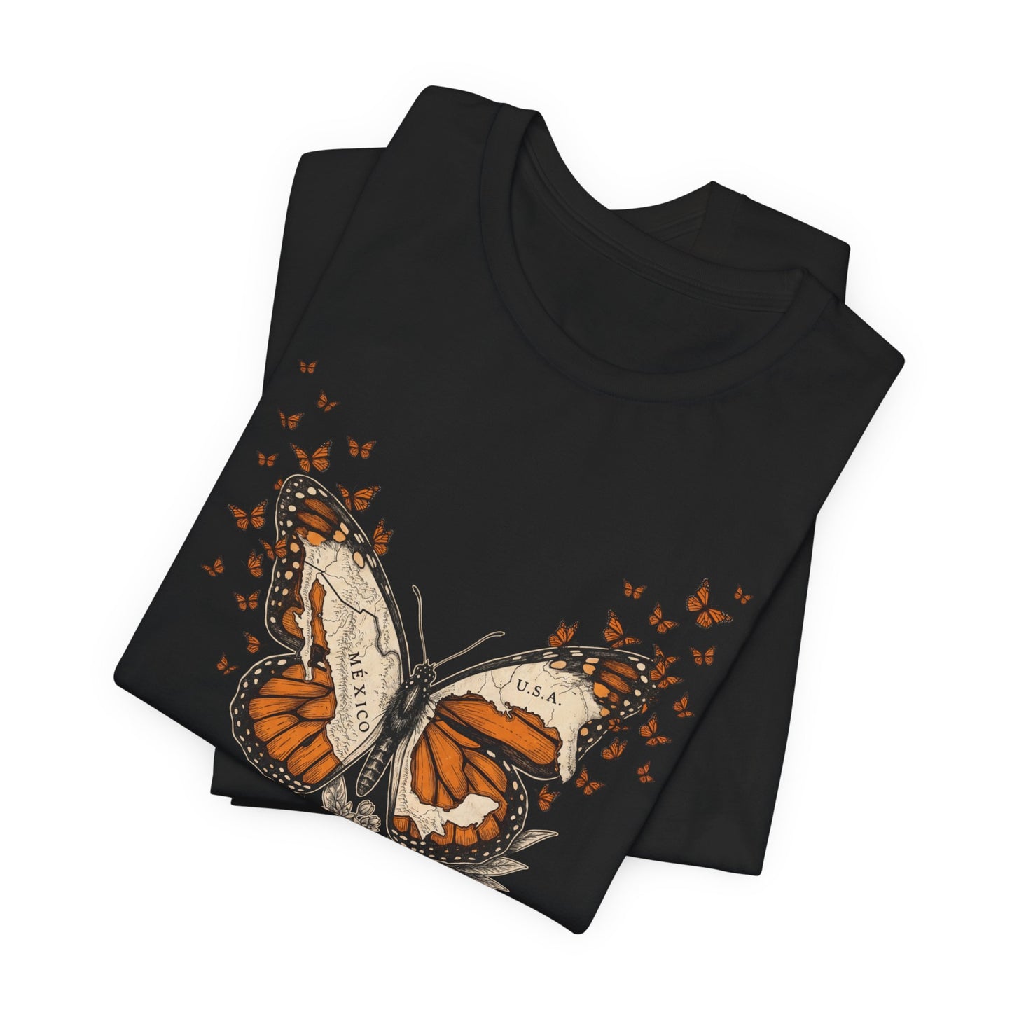 Black t-shirt with a monarch butterfly and map outline of Mexico and USA.