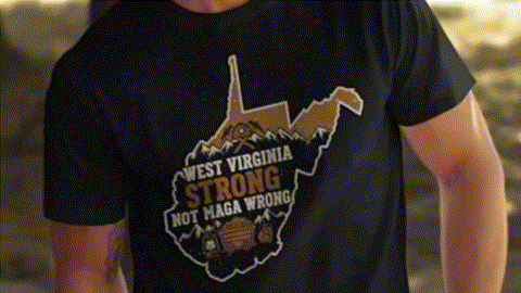 A black t-shirt with a graphic design depicting a map of West Virginia and the text "West Virginia Strong Not Maga Wrong".
