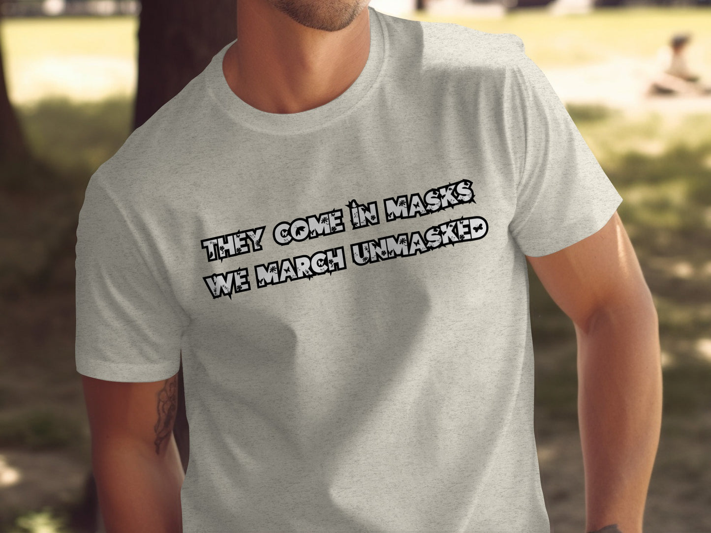 They Come In Masks We March Unmasked T-shirt product