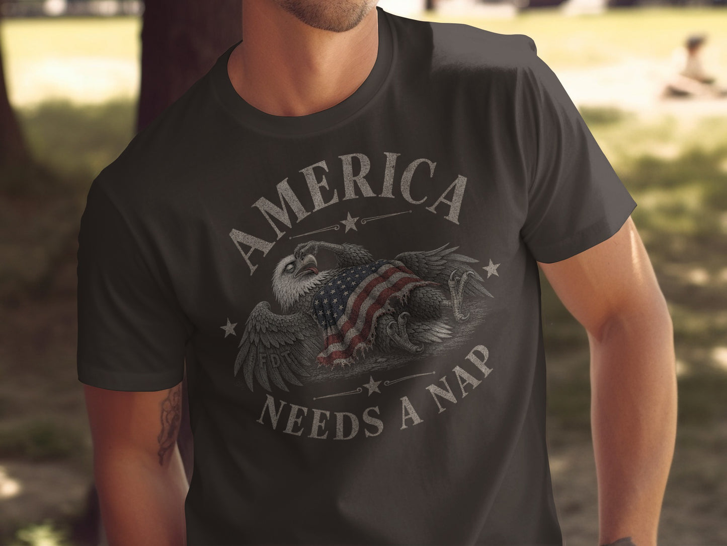 Dark t-shirt with American flag and eagle graphic and "America Needs A Nap" text.