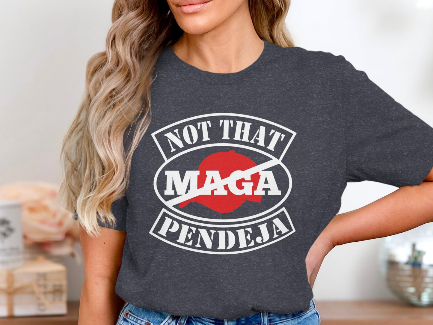 Dark t-shirt with "Not That MAGA Pendeja" graphic.