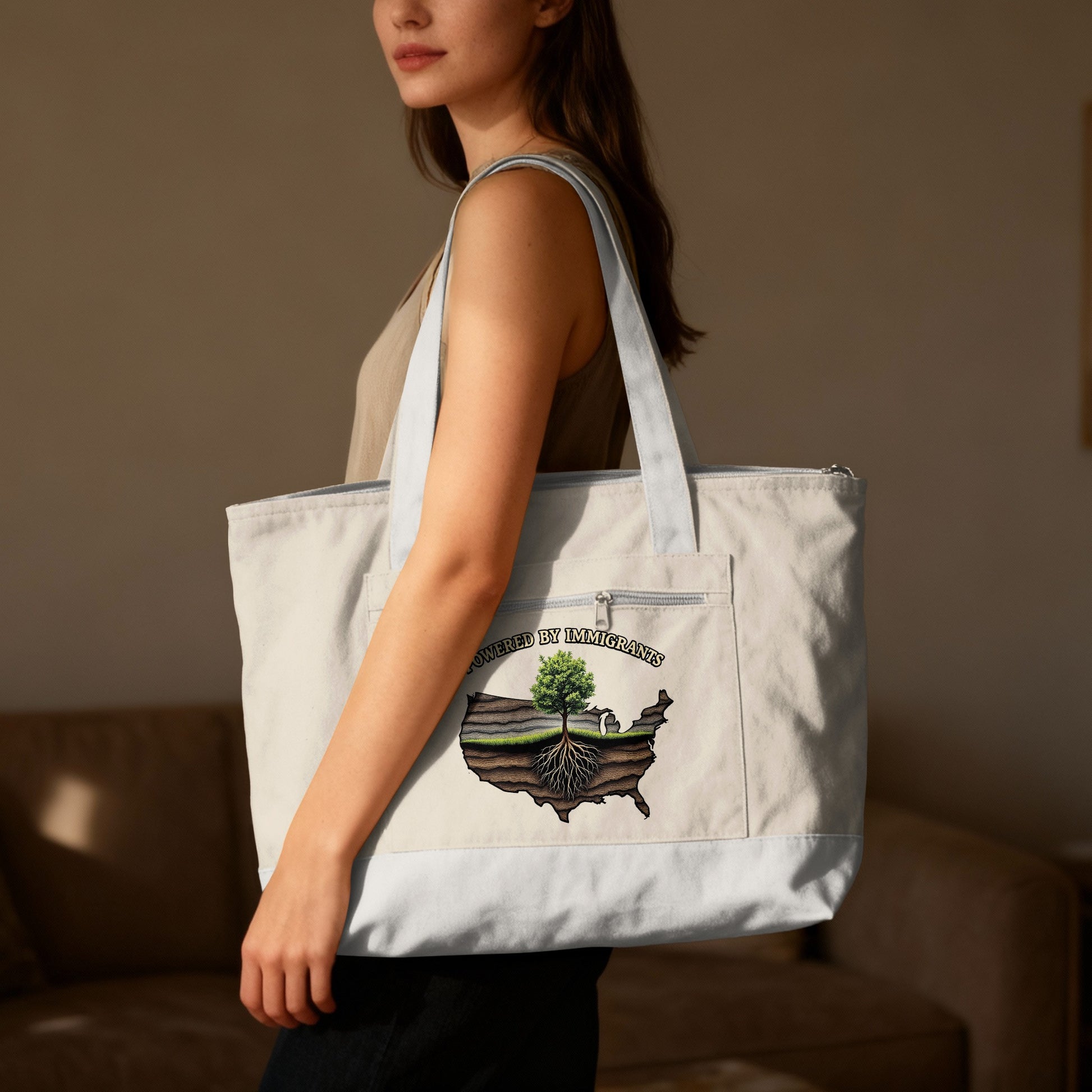 Tote bag with "Powered by Immigrants" text and US map graphic.