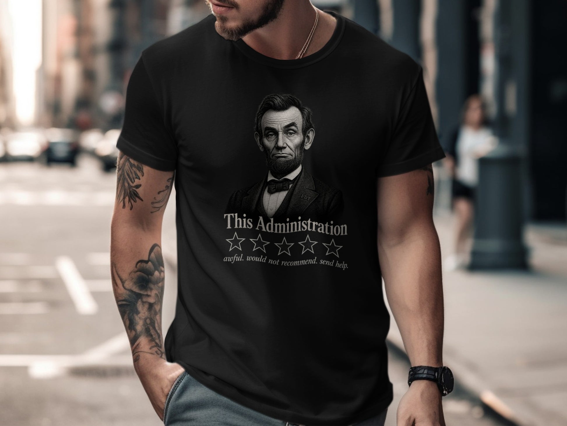 Black t-shirt with Abraham Lincoln portrait and "awful. would not recommend. send help."