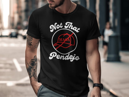 Black t-shirt with "Not That Pendejo" text and a red baseball cap graphic.