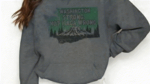 A person wearing a gray sweatshirt with a graphic design on the back.
