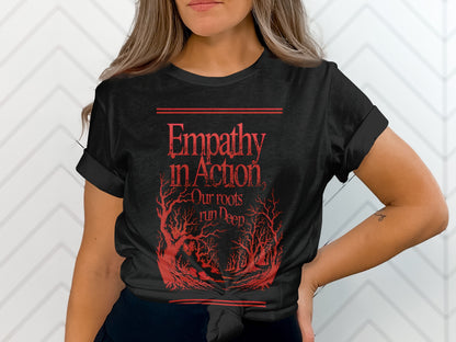 Black t-shirt with red text and tree design reading "Empathy in Action Our roots run deep".