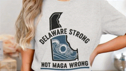 A woman wearing a white t-shirt with a graphic design and text printed on it.