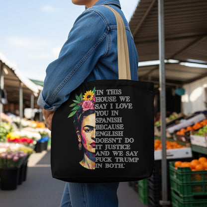 Black tote bag with Frida Kahlo art and quote in white text.