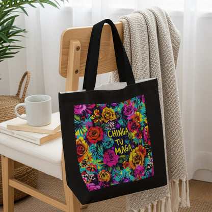 Black tote bag with vibrant floral pattern and colorful text.