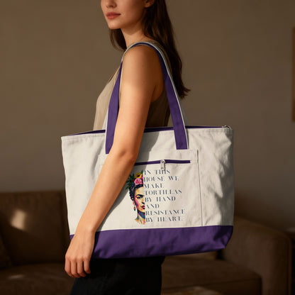 Tote bag with Frida Kahlo portrait and "tortillas by hand and resistance by heart" text.