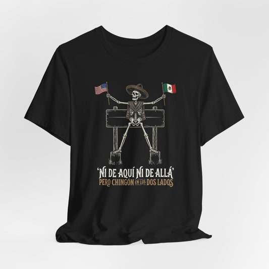 Skeleton in sombrero holding US and Mexican flags with text "Ni de aqui ni de alla, pero chingon en los dos lados".