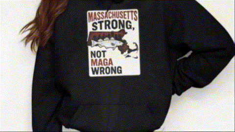 A person wearing a black hoodie with a graphic design on it.