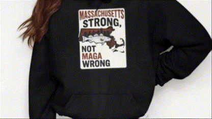 A person wearing a black hoodie with a graphic design on it.