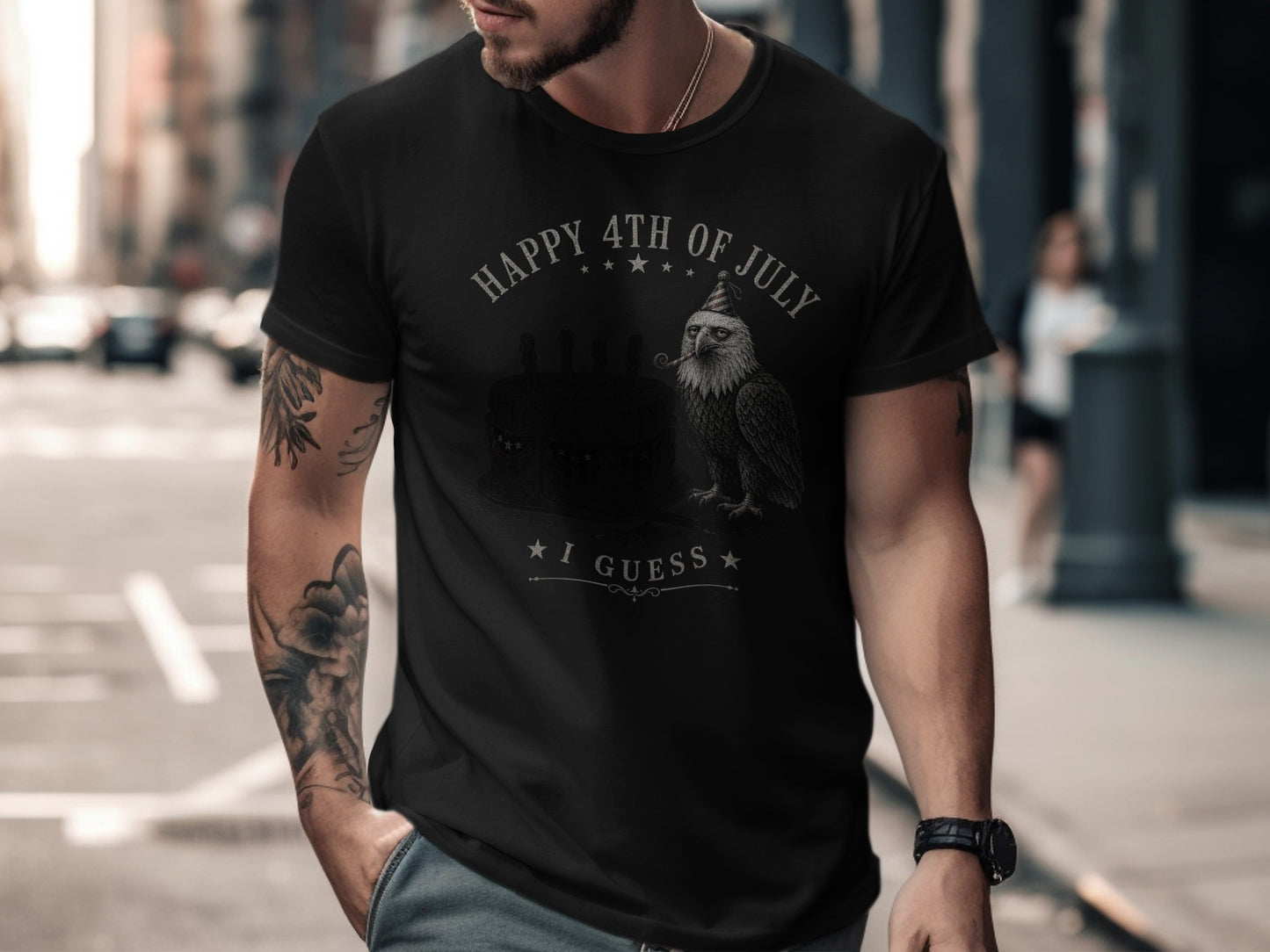 Black t-shirt with eagle and cake graphic, "Happy 4th of July I Guess" text.