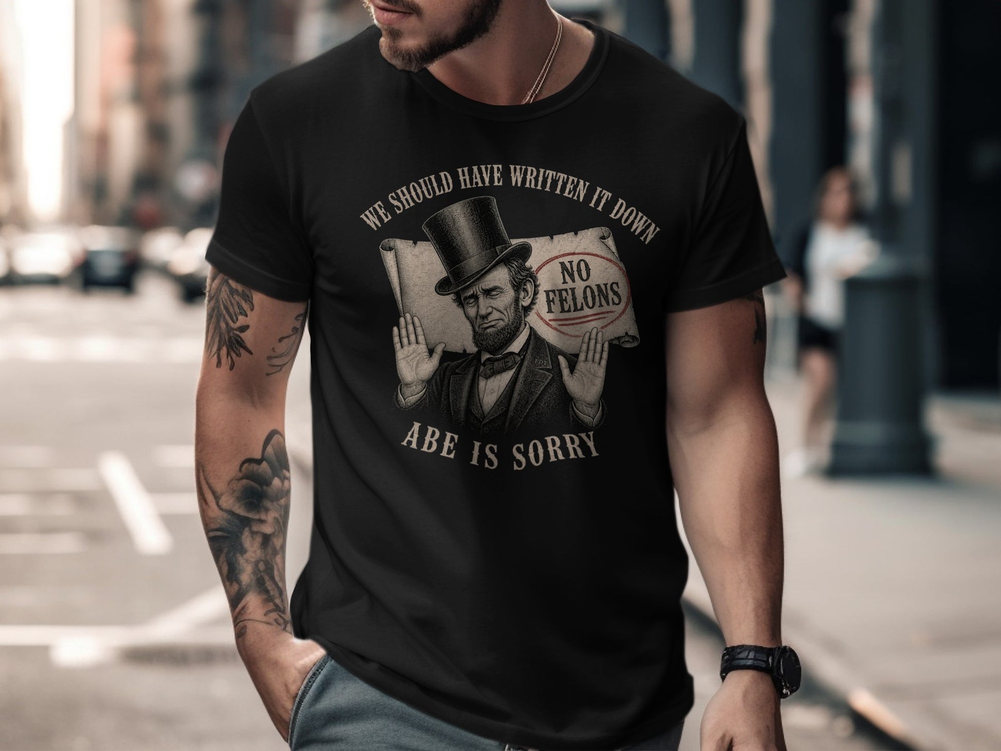 Black t-shirt with "WE SHOULD HAVE WRITTEN IT DOWN" and Abraham Lincoln graphic.