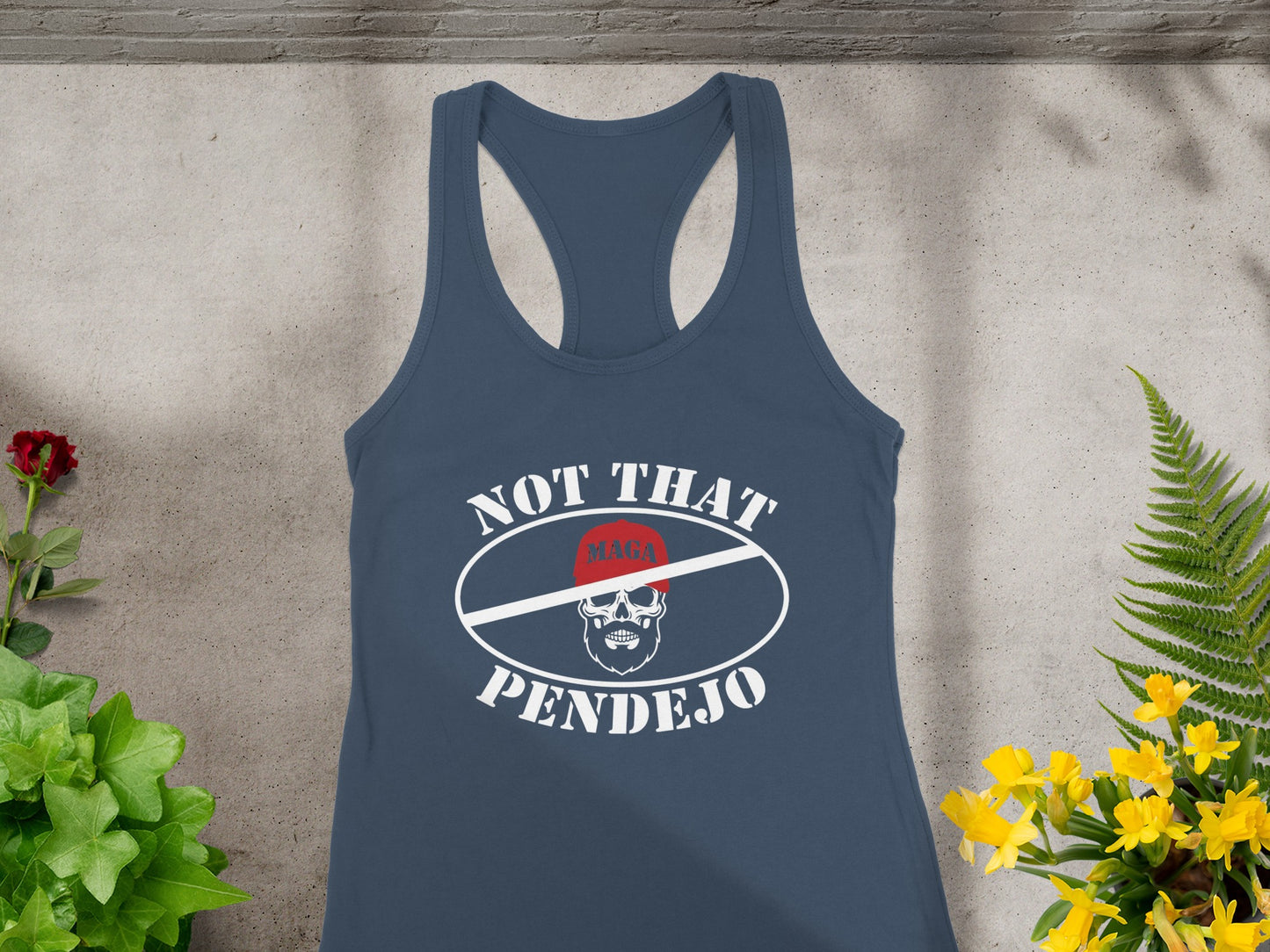 Blue tank top with "NOT THAT PENDEJO" and a crossed-out MAGA hat logo.