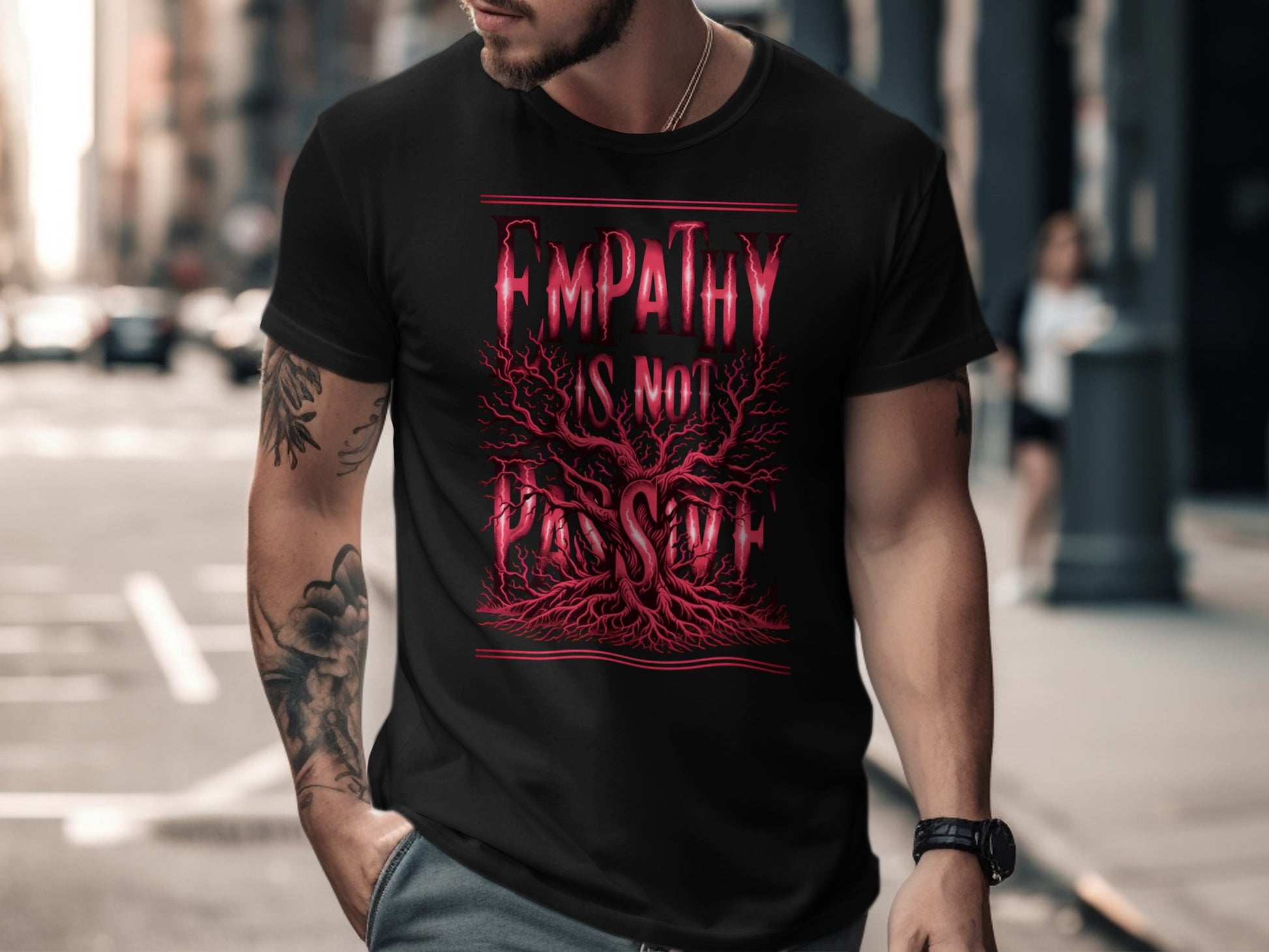 Black t-shirt with red "EMPATHY IS NOT PASSIVE" text and tree design.