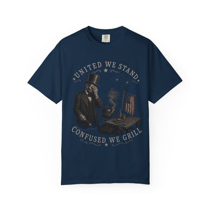 Navy t-shirt with "United We Stand, Confused We Grill" text and patriotic grilling graphic.