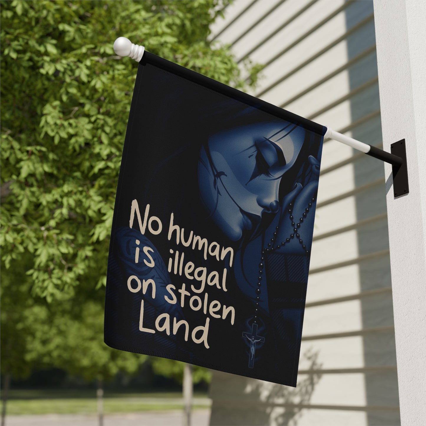 No Human Is Illegal on Stolen Land flag