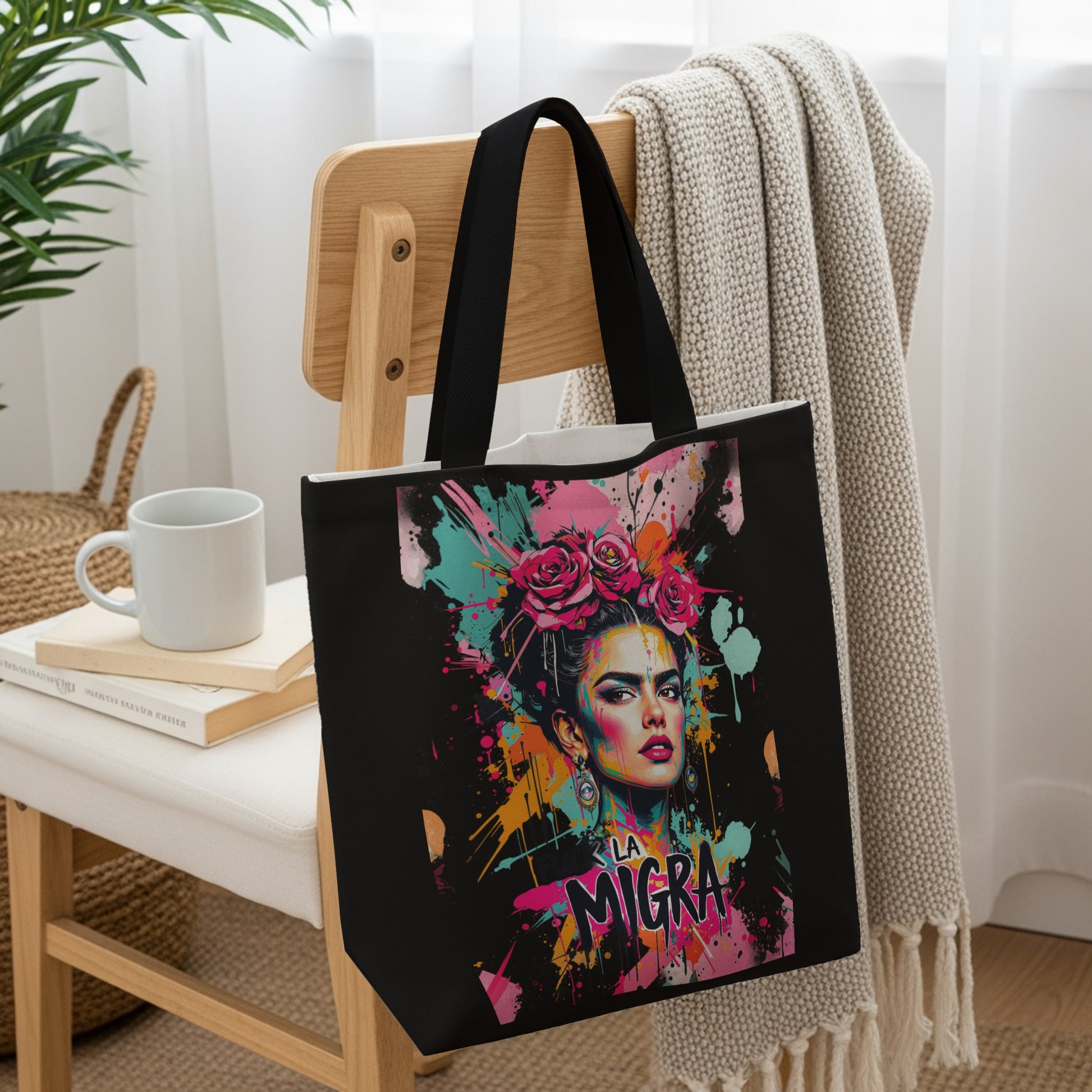 Black tote bag with colorful Frida Kahlo-inspired art.