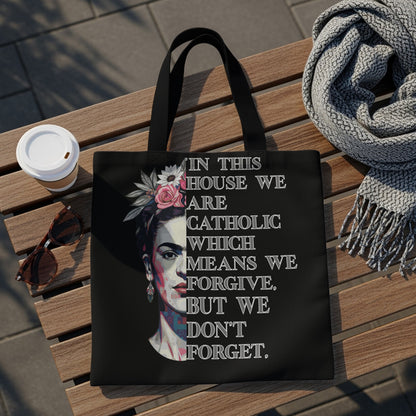 Tote bag with Frida Kahlo portrait and text about forgiveness and memory.