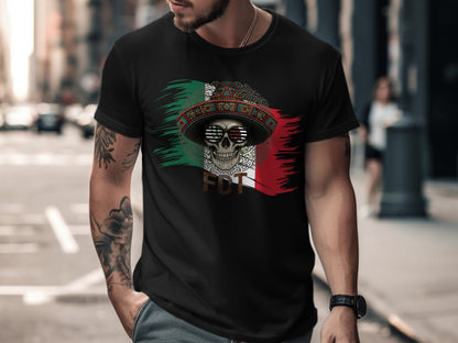 Man wearing black t-shirt with Mexican flag, sombrero, and skull graphic.