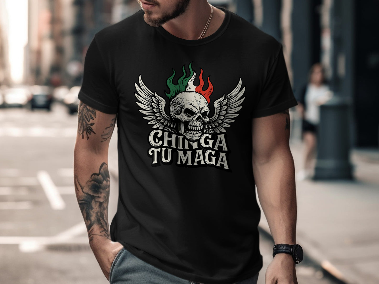 Black t-shirt with skull, wings, and text "CHINGA TU MAGA".