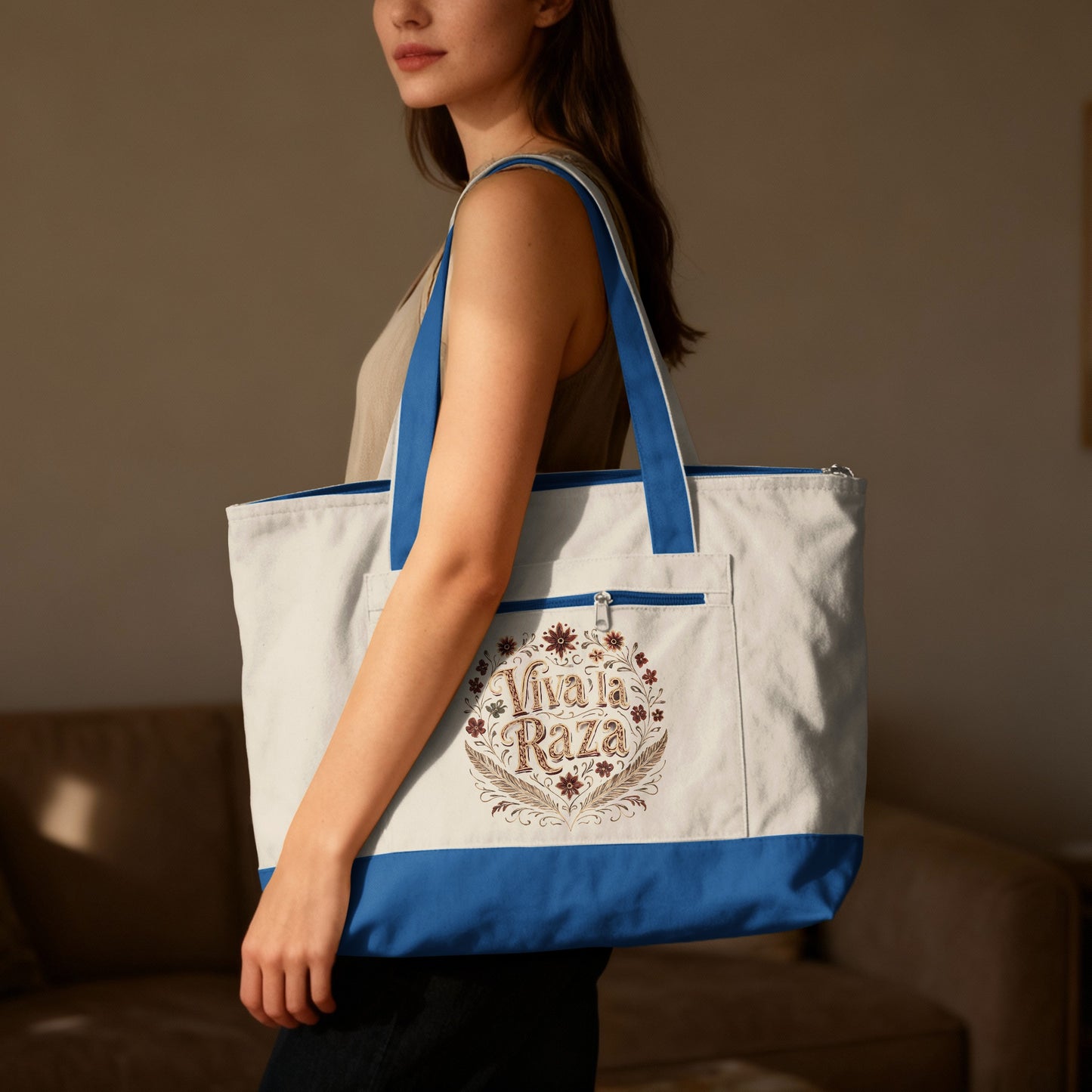 Canvas tote bag with "Viva la Raza" floral embroidery.