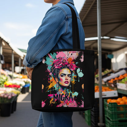 Tote bag with colorful Frida Kahlo portrait and "La Migra" text.