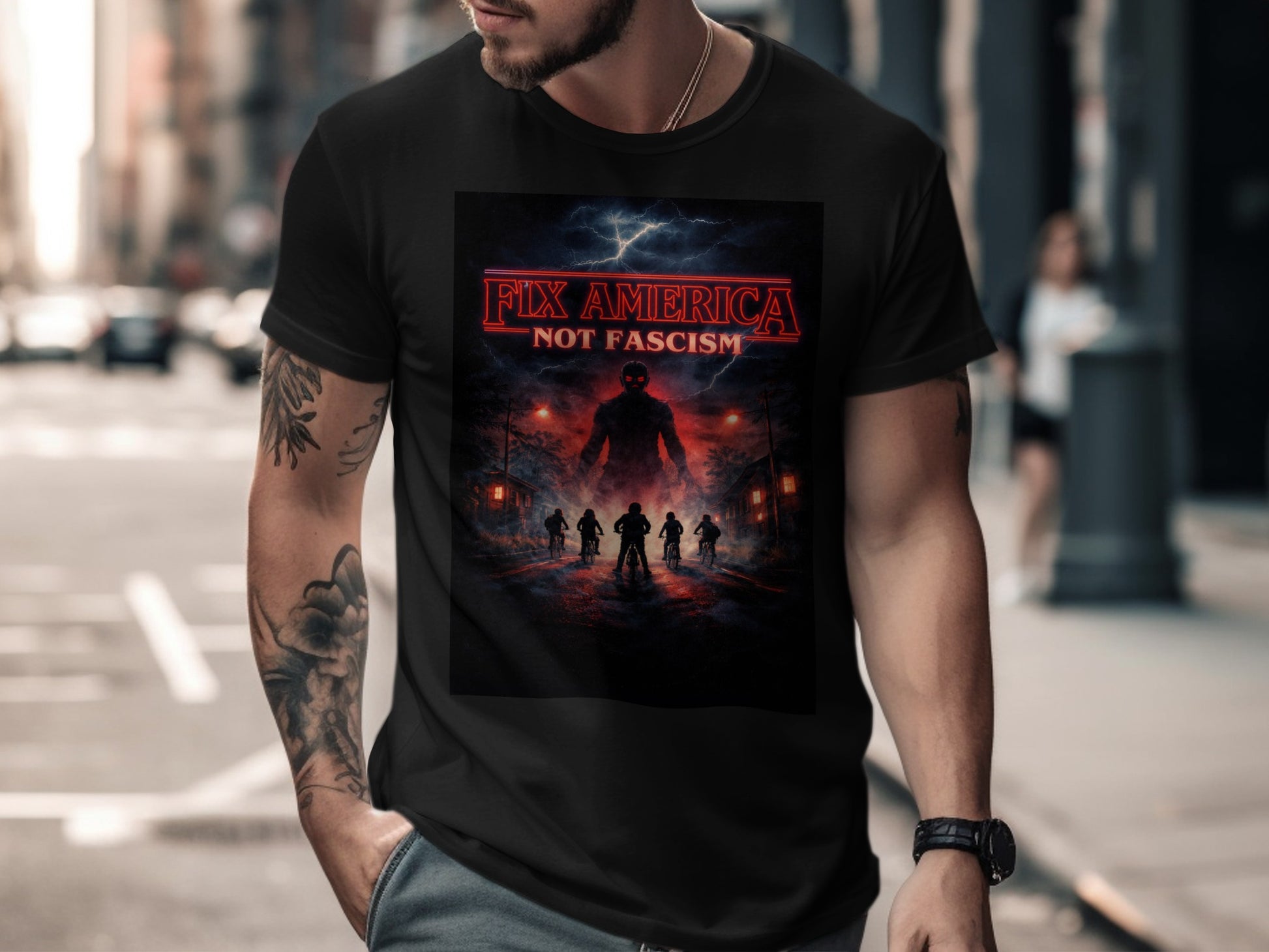 Black t-shirt with "FIX AMERICA NOT FASCISM" text and a dark, silhouetted scene.