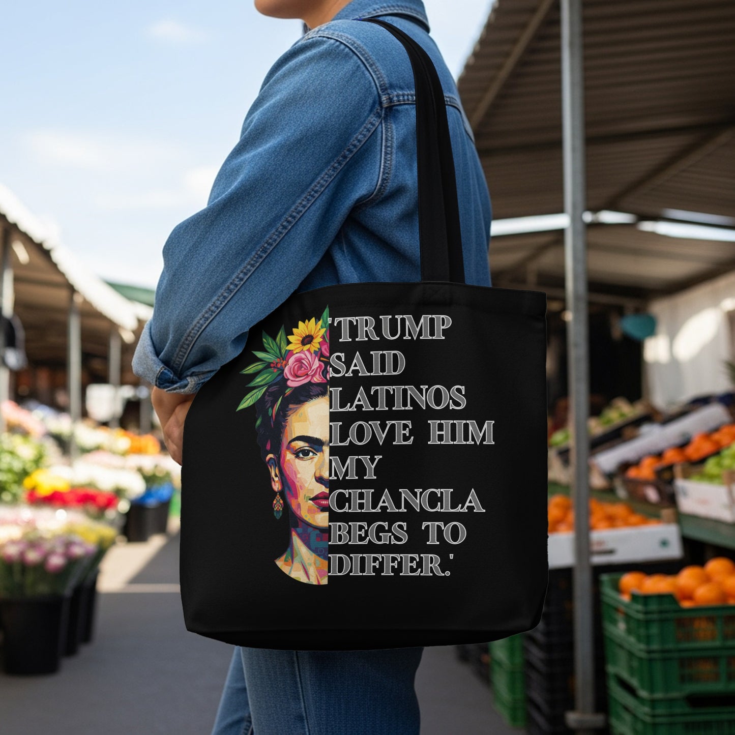 Black tote bag with Frida Kahlo graphic and "Trump said Latinos love him my chancla begs to differ" text.