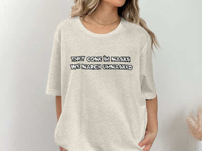 They Come In Masks We March Unmasked T-shirt product