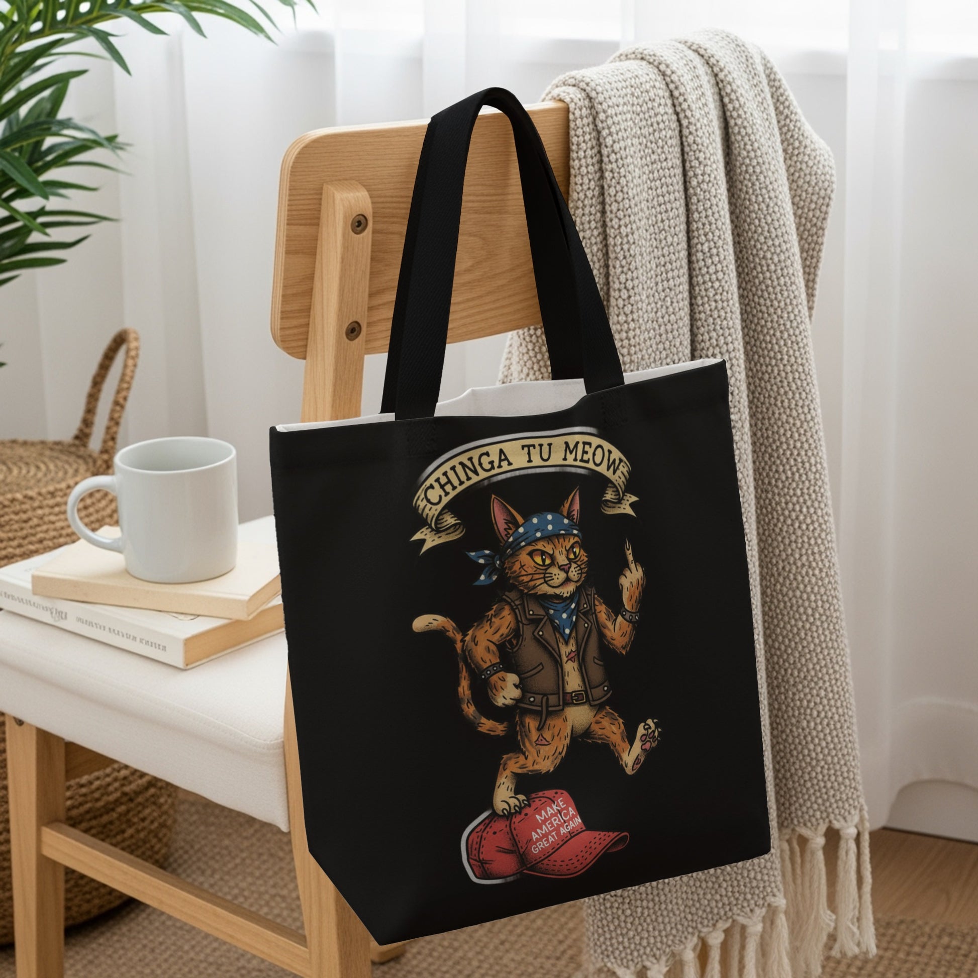 Tote bag with a cat wearing a bandana and leather jacket, flipping off the viewer.