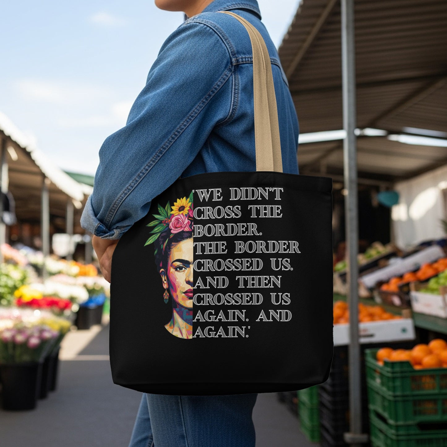 Black tote bag with floral headscarf graphic and quote about borders.