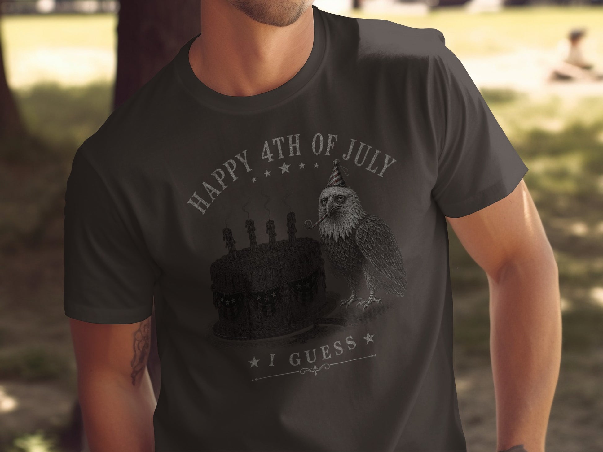 Dark t-shirt with "Happy 4th of July I Guess" and an eagle wearing a party hat.
