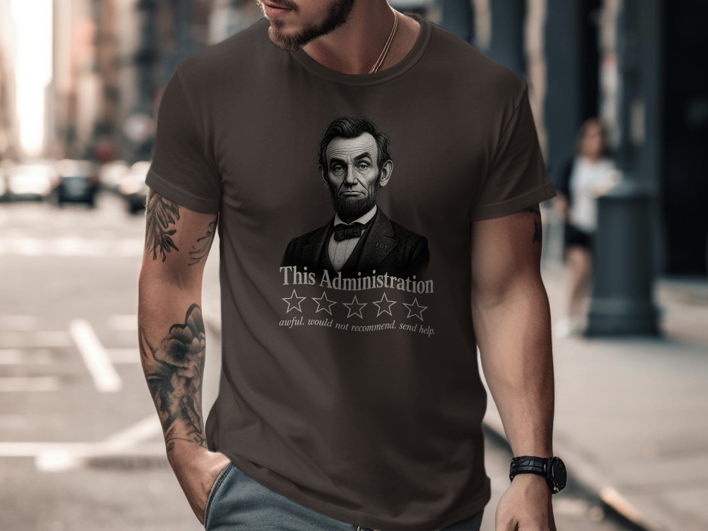 Dark t-shirt with Abraham Lincoln portrait and "awful. would not recommend. send help." text.
