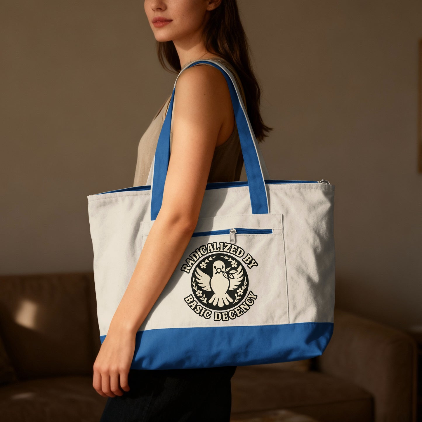 Canvas tote bag with "Radicalized by Basic Decency" text and dove logo.