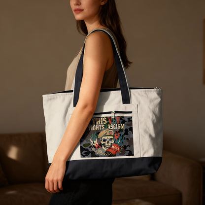 Canvas tote bag with "THIS FIGHT IS FASCISM" text and skull graphic.
